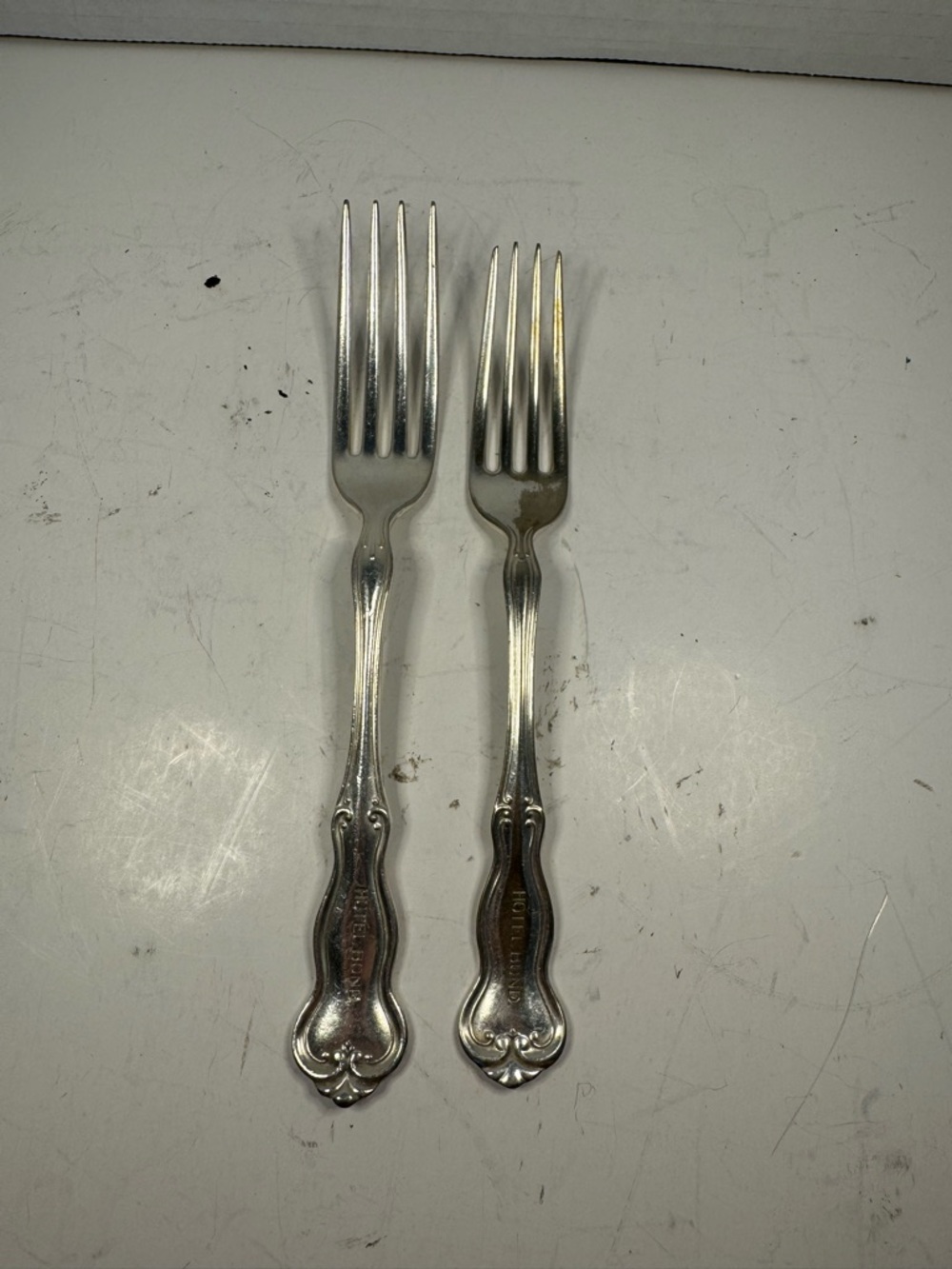 vintage silverplate forks are marked for "HOTEL BUND” H. Rodger’s
